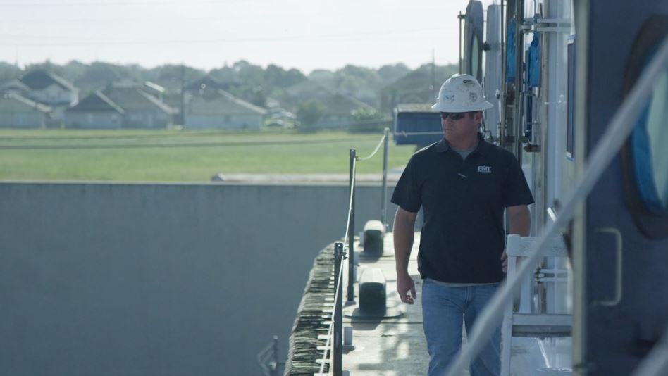Florida Marine Transporters employee on towboat