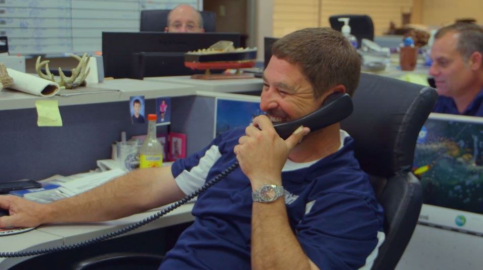 Florida Marine Transporters employee on the phone