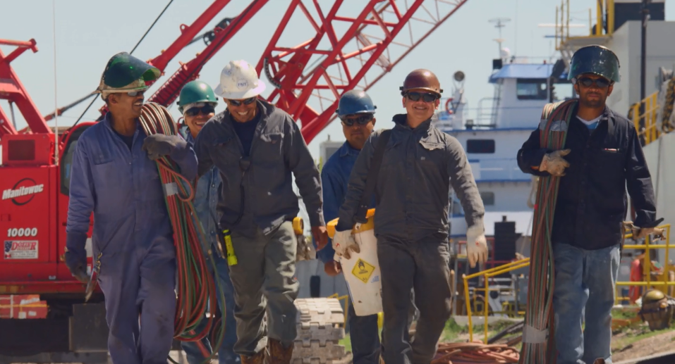 Group photo of Florida Marine Transporters employees at the shipyard