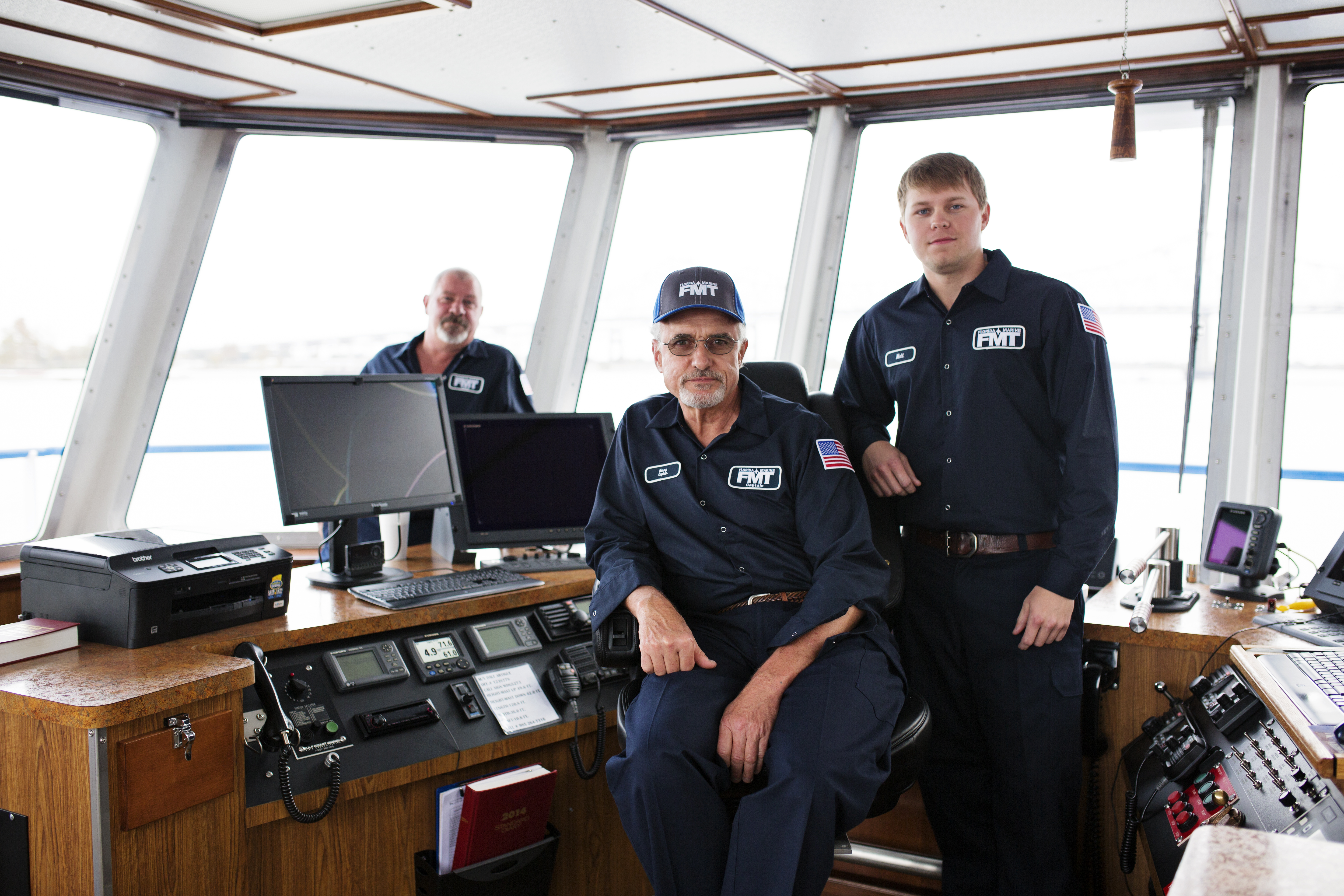 Crew members in towboat wheelhouse