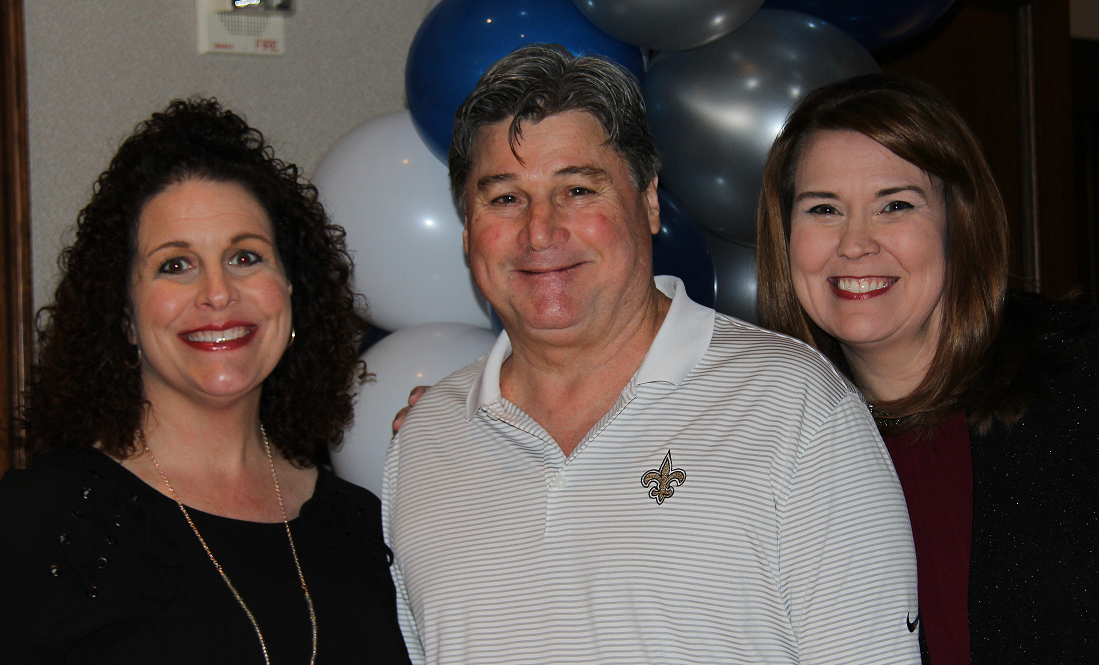 Photo of three Florida Marine Transporters employees at charity event